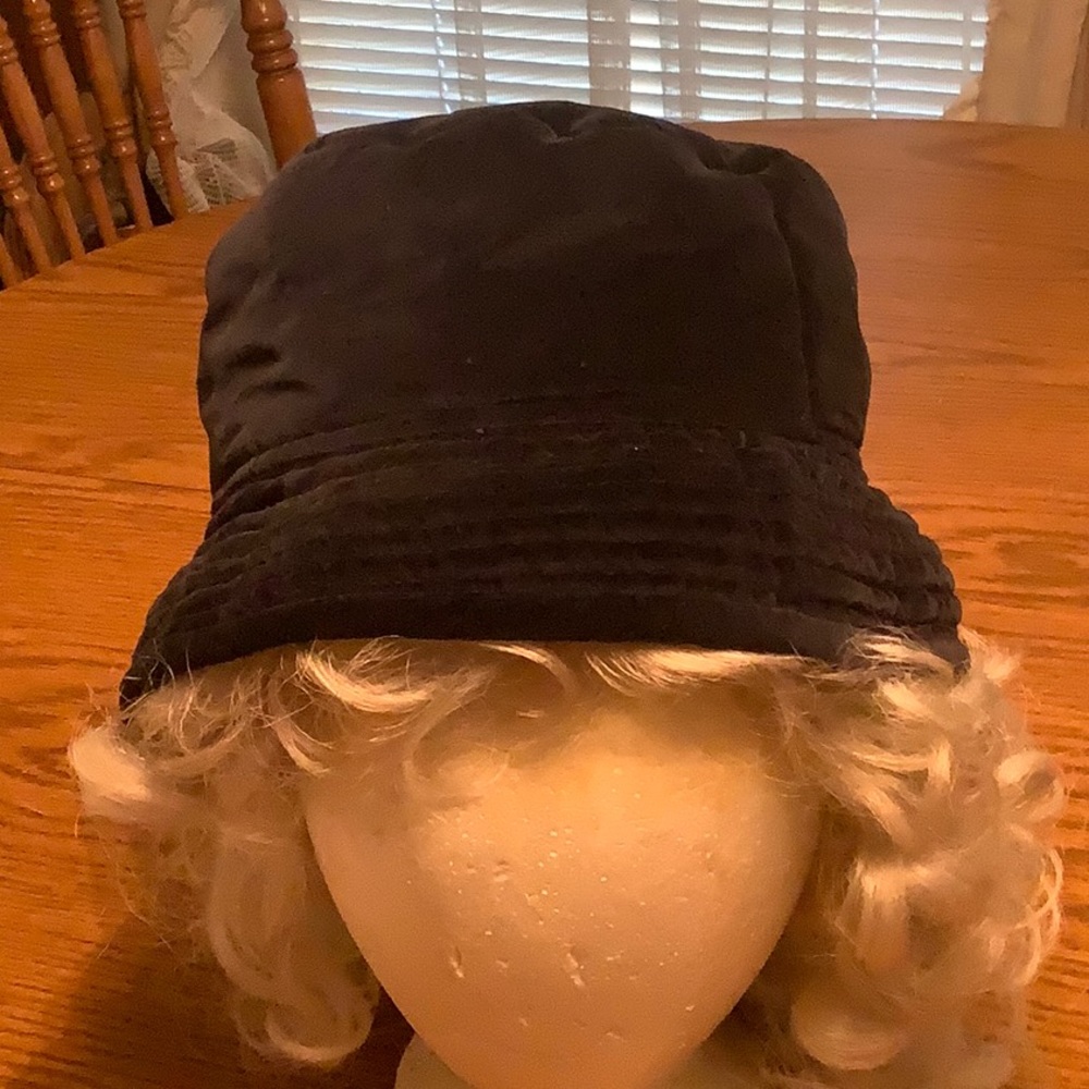 Vintage Navy Blue hat. Can be worn with brim up or down. Silk lined